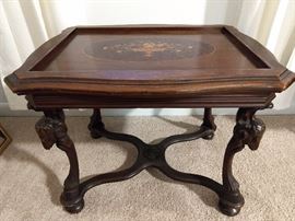 Antique English mahogany side table with carved ram's heads, inlay and a glass butler's tray that you don't see. I have it, but you have to come to the estate sale for a viewing.
Yep, I'm that guy...