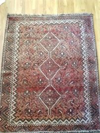 Tribal Persian rug, 100% wool, hand woven, measures 6' x 9'.