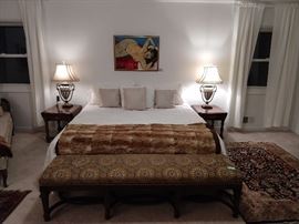 King size bed, with all linens, authentic alpaca fur quilt (one of two), with an antique English mahogany bench, pair of vintage oak side tables, pair of decent table lamps, vintage silk Persian rug and romance-inducing red-hot mama above the bed, by none other than a local boy-done-good-artist, Jim McRae