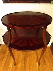 Antique French two-tier table, with bronze dore feet.