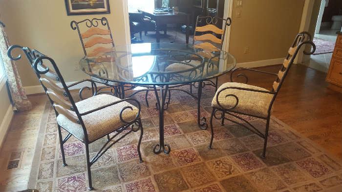 $200   Round, glass table with metal base and chairs  measures   54"