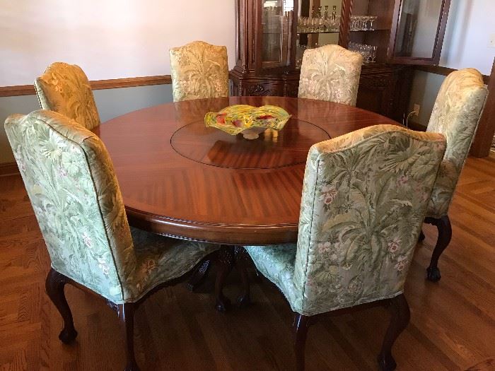 Hand carved round Mahogany dining room table w/7 custom upholstered wooden chairs 