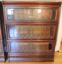Pair of Globe Wernicke Mahogany 8 ½ Grade Leaded Glass Three Section Bookcases.  
Sold 1 x 2  Note:  one diamond panel is missing from one section.  Easily replaced.
