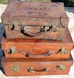 Lot of Three London Hard Leather Suitcases.  
Natural leather exteriors with brass locks signed EA Ratcliffe Newton Park Burton On Trent.  