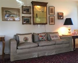 A Lighted Wall Case with Gilt French-Style Framing;  84" Down-Filled Brocade Sofa; One of the Area Rugs