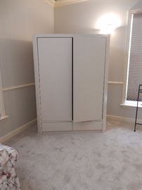 CUSTOM BEDROOM SUITE  $1200.00
King Sized, Bookcase style headboard with night tables included.  The bed is Platform in style, Includes Custom Matching Armoire. Modern in Style, White Formica Style Finish on all pieces.
