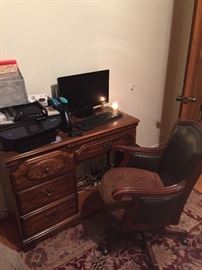 Desk, dell computer, Upholstered Office Chair, and office supplies