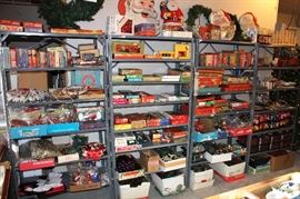 Shelving units of boxed vintage Christmas lighting.