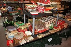 Various vintage Christmas designed gift boxes and shopping bags.