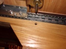 Furnish your dining room with a durable and long lasting rectangular dining table. The table has an elegant trestle base and beautiful scalloped edges for a traditional American style. It's made completely out of solid oak, making the base extremely strong and durable. Features of this table include rounded edges, brass leaf alignment pins, heavy duty brass sash locks, and the dual ball bearing cable glide extension mechanism for a smooth operation. Also included are two 18 inch  leaves that expand to accommodate eight guests comfortably. 4 side chairs and 2 arm/captain chairs.