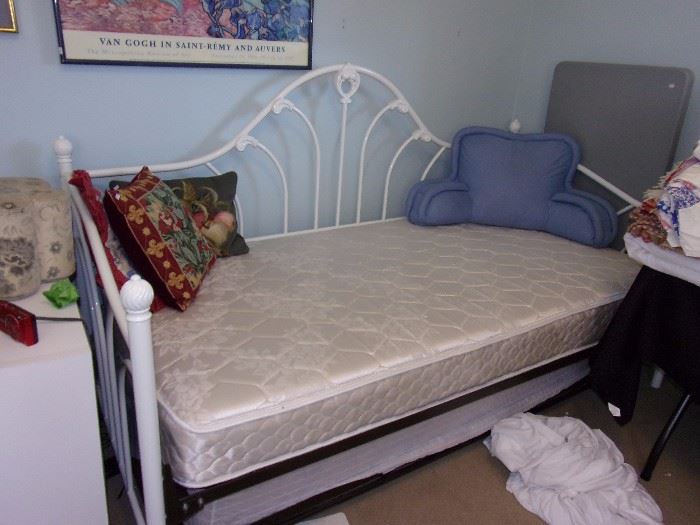 One of two Trundle day beds Iron white ornate with two twin mattresses