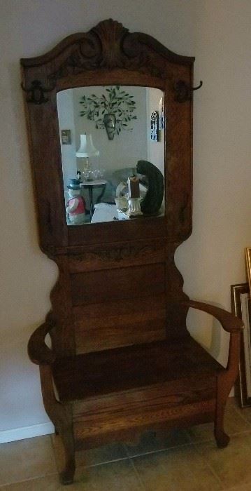 Beautiful antique hall mirror with settee.