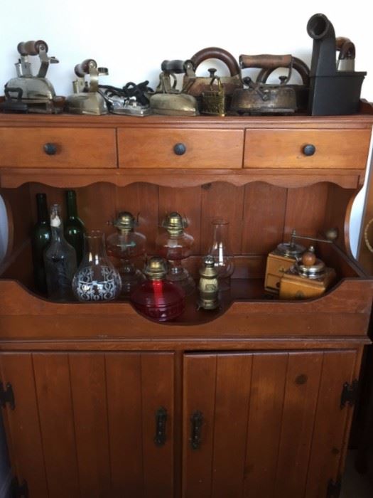 Colonial Style Cabinet, Antique Clothing Irons (Flat-Irons, Sad-Irons), Trivets, Oil Lanterns, Grinders/Mills.