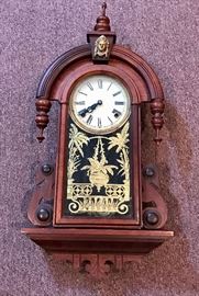 Grecian style wood pendulum wall clock  http://www.ctonlineauctions.com/detail.asp?id=649307