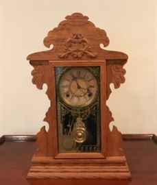 Wood mantle clock  http://www.ctonlineauctions.com/detail.asp?id=649321