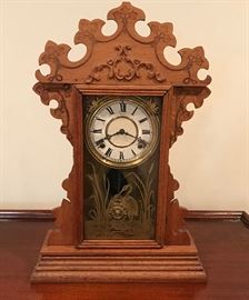 Wood mantle clock  http://www.ctonlineauctions.com/detail.asp?id=649323