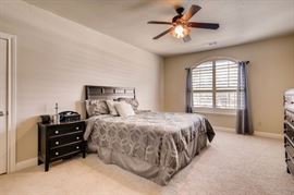Queen size bed and night stands, dresser, bedding.