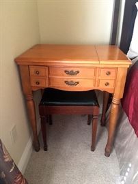 Vintage sewing machine and table.