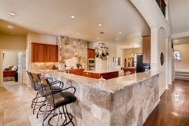 Bar stools, pots and pans, dishes, glassware.