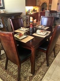 Dining table with leaf and 4 beautiful chairs.