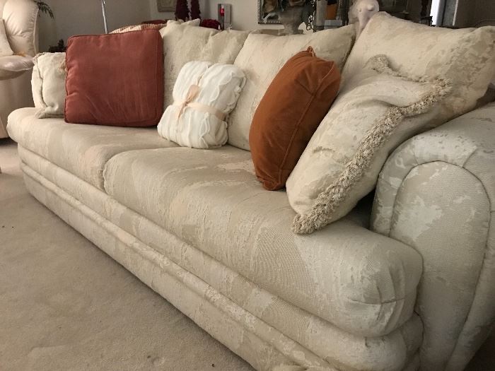 Cream Brocade Two Cushion Sleeper Sofa with Six Extra Matching Cushions  (length 88”)
450.—