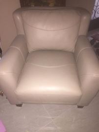 Cream colored leather arm chair. Never used as it's in the "formal living room". Matching full size couch optional.