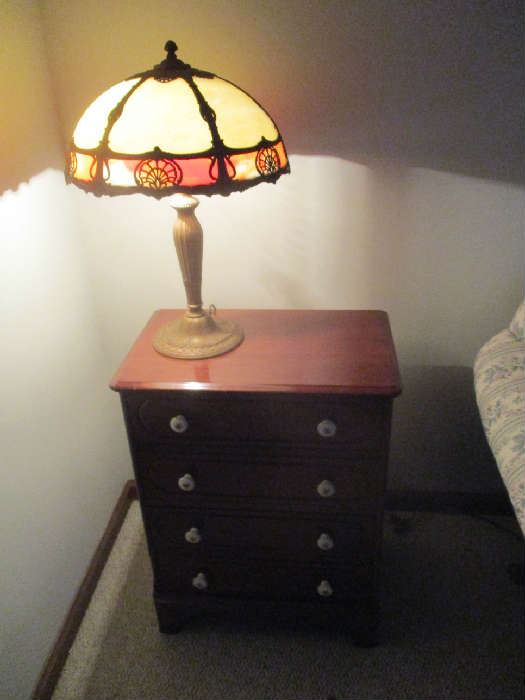 Small stand and reverse painted Tiffany style table lamp