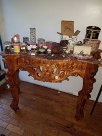 Antique table with pink marble top. A corner of the marble is cracked therefore price is negotiable.