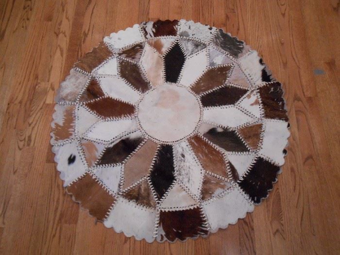 Various skins made into a rug or wall hanging