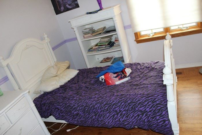 white twin bed with mattress