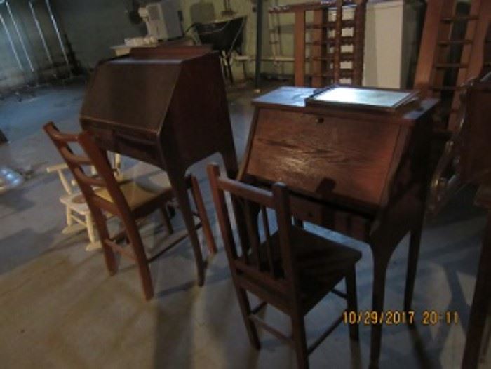 Two children's desks. Both are oak and have fall front lids with drawer beneath.  The interiors are fitted.  