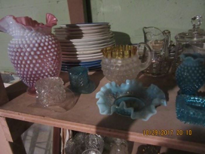 A view of some of the glass in the sale Pressed, hobnail, and plates. 