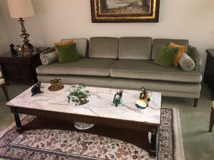 Marble topped coffee table, couch, area rug and decor