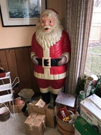 Molded plastic Santa - a give-away from Polk Bros in the early 1960's. He is constructed with 2 molded shells (a front side and back) joined together along the seams with staples. 