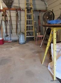 Metal saw horses, items covered under table not for sale.