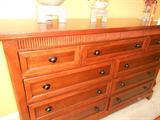 Queen size sleigh bed with bureau and end tables.