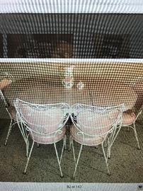 1950's Kitchen Set formica pink and gray marble looking top, table with one leaf, four woodard iron chairs with pink vinyl seats.Excellent condition .Final  Sale price                                              $ 450.00