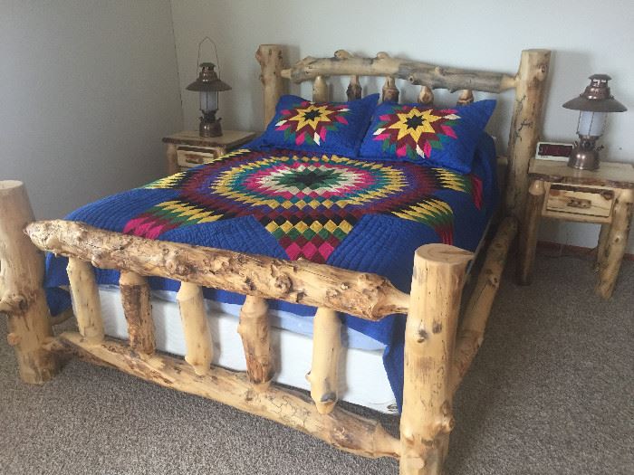 New pine log queen bed with new mattress set. Has matching chest and 2 night stands