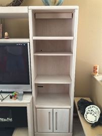 Both sides of entertainment center, 4 shelves (client taking middle section)