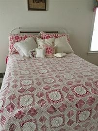 Crocheted bedspread and other bed linens.  Iron Bed not for sale.