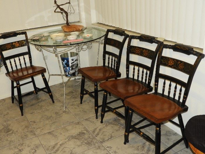 Small metal & glass table.   Set of 4 wooden chairs.