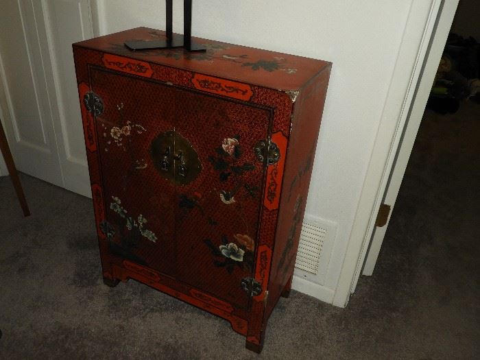 Small red Oriental cabinet