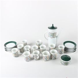Hans Theo Baumann for Rosenthal "Korso" Mid Century Tea Service: A Korso tea service designed by Hans Theo Baumann for Rosenthal. This white Mid Century porcelain is decorated with a pastel abstract design and accented with dark green elements. Included are twelve cups and saucers, a teapot, and creamer and lidded sugar bowl set. The undersides are marked “Rosenthal, Germany”.