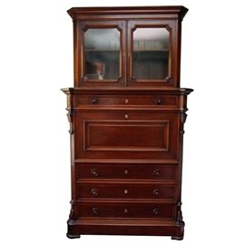 Antique Renaissance Revival Secretary Desk: An antique Renaissance Revival secretary desk. This mid 19th century Northern European secrétaire à abattant with book cabinet is made of walnut and burl walnut veneer in the Renaissance Revival style which was popular in Europe and North America 1850-1880. The fold down front of the desk, which serves as the writing surface when down, is covered in green baize; with the interior fitted with three long drawers at the top and below them one large cubby hole with an arch of flame birch which is flanked on both sides by three small cubby holes, also flanked on both sides by three short drawers; with three long drawers at the bottom; all of the drawers having flame birch drawer fronts with walnut turned knobs. Above the fitted desk is one long drawer; and below are three long drawers, all with a raised molding bordering the edge of the drawer and two turned walnut knobs. The corners of the secretary are chamfered with applied walnut pilasters, wi