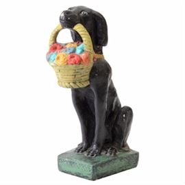 Cast Concrete Dog Sculpture: A hand-painted, cast concrete sculpture of a black dog, holding a basket of multicolored flowers in its mouth. Unsigned.