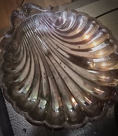 Large assortment of silver plated serving dishes and trays.