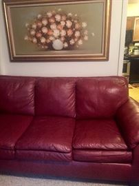 Almost new contemporary red leather couch from art van