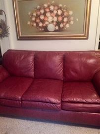 Beautiful couch has matching chair and ottoman