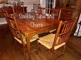 Cherry Stickley Table and Chairs; hidden extensions and eight chairs including two captains chairs 