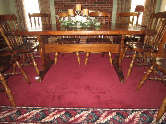 Solid Pine trestle table with bread board ends, 2 leaves, and 9 chairs